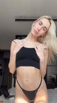 Skinny 18-year-old blonde shows off her small boobs on camera.mp4